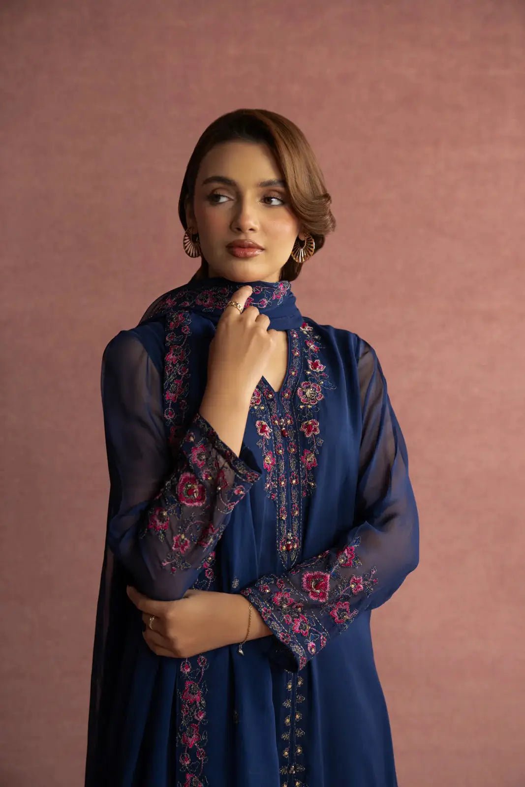 Close-up of CHINYERE 3 Piece Suit showing detailed pink floral embroidery on navy chiffon fabric, adding elegance to the neckline and sleeves.