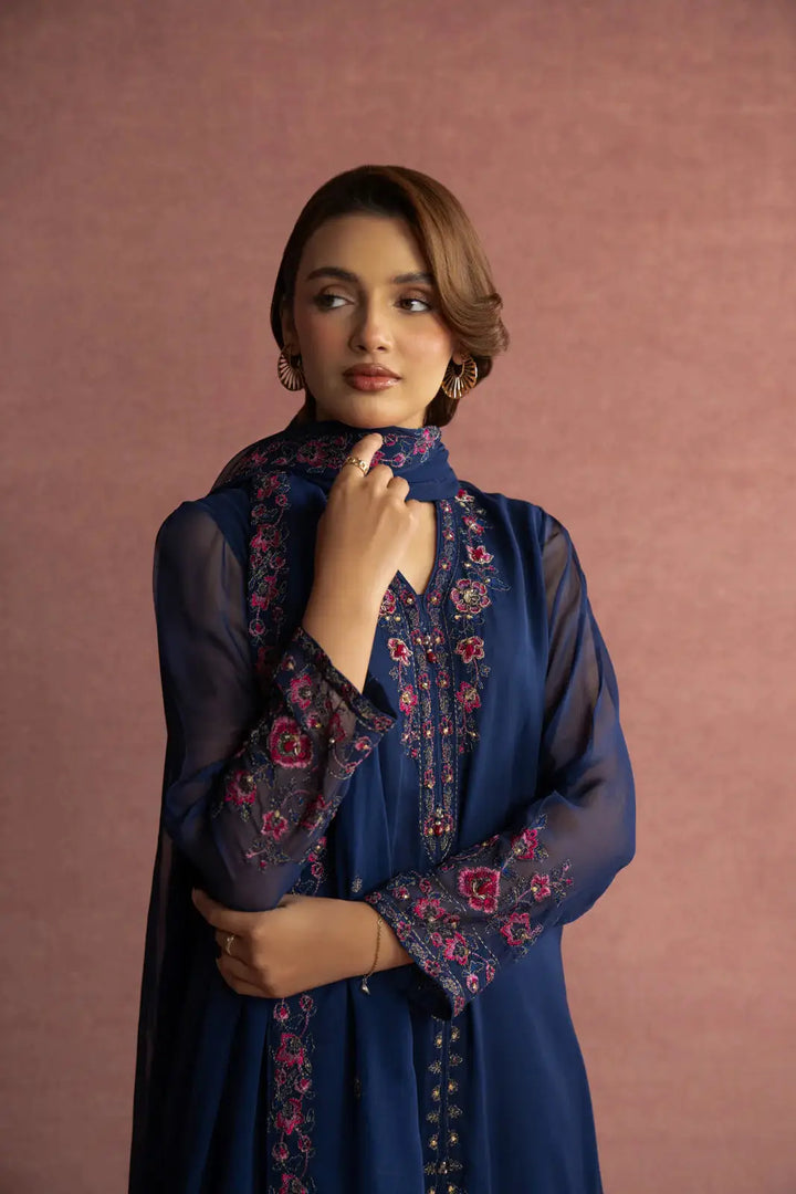 Close-up of CHINYERE 3 Piece Suit showing detailed pink floral embroidery on navy chiffon fabric, adding elegance to the neckline and sleeves.