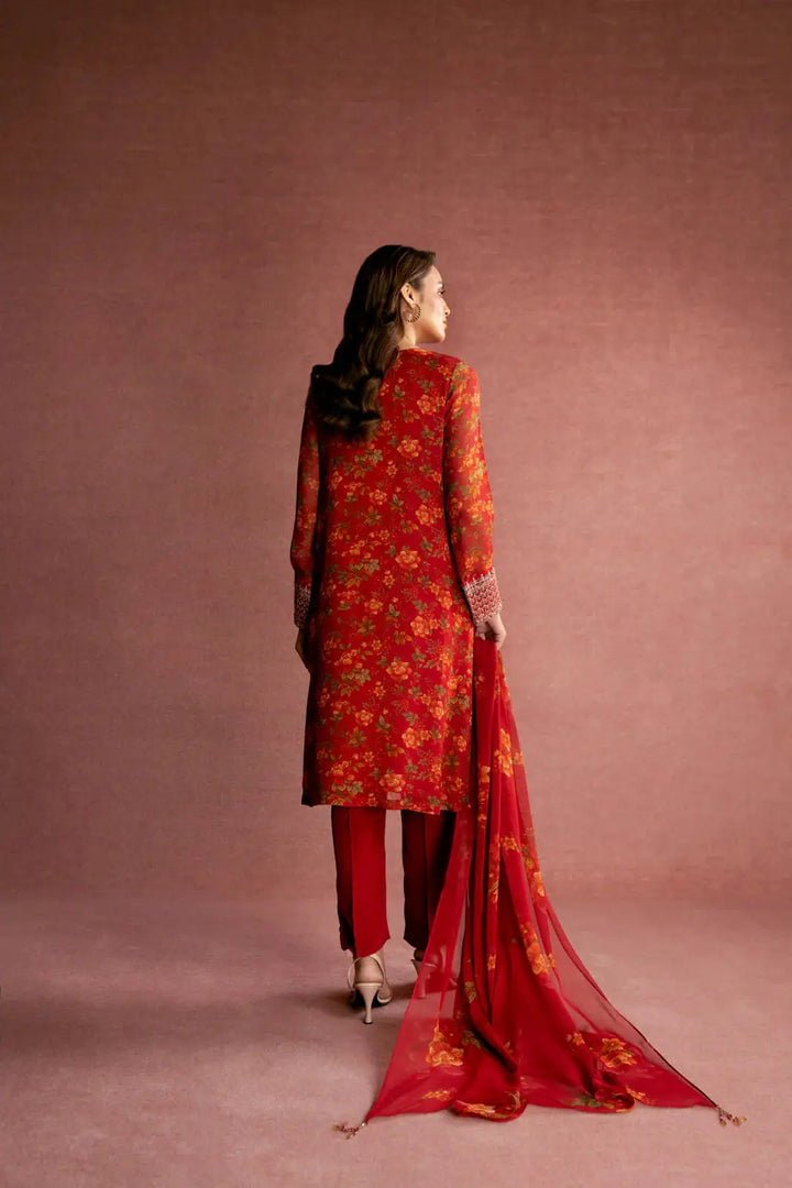 Back view of CHINYERE 3 Piece Printed Chiffon Embroidered Suit in red, showcasing floral design on shirt and dupatta. Stylish ceremonial outfit in traditional fashion.