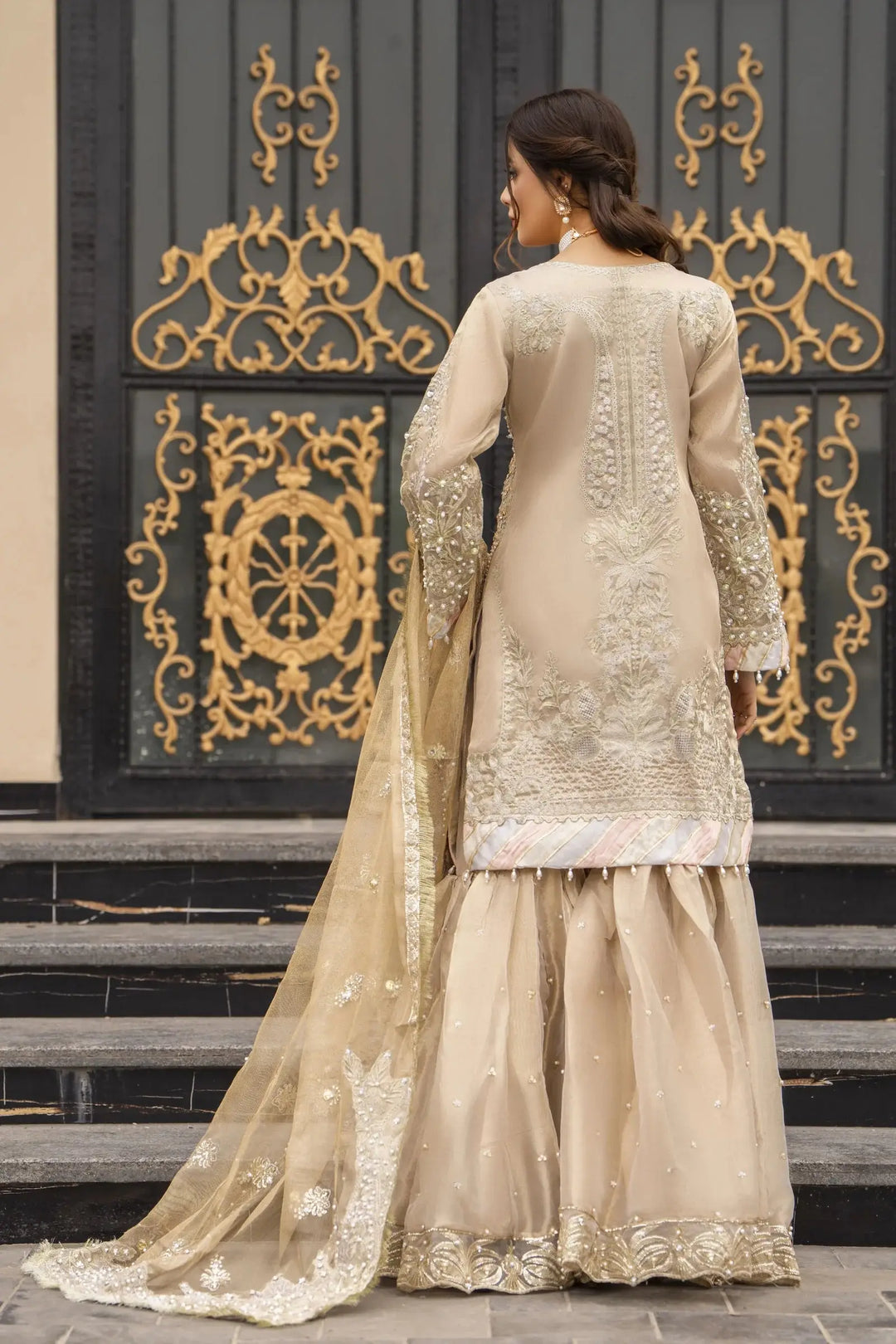Back view of AROOSH Kundan Masoori Embroidered Shirt with Gharara & Dupatta, showcasing intricate embroidery and elegant fabric flow.