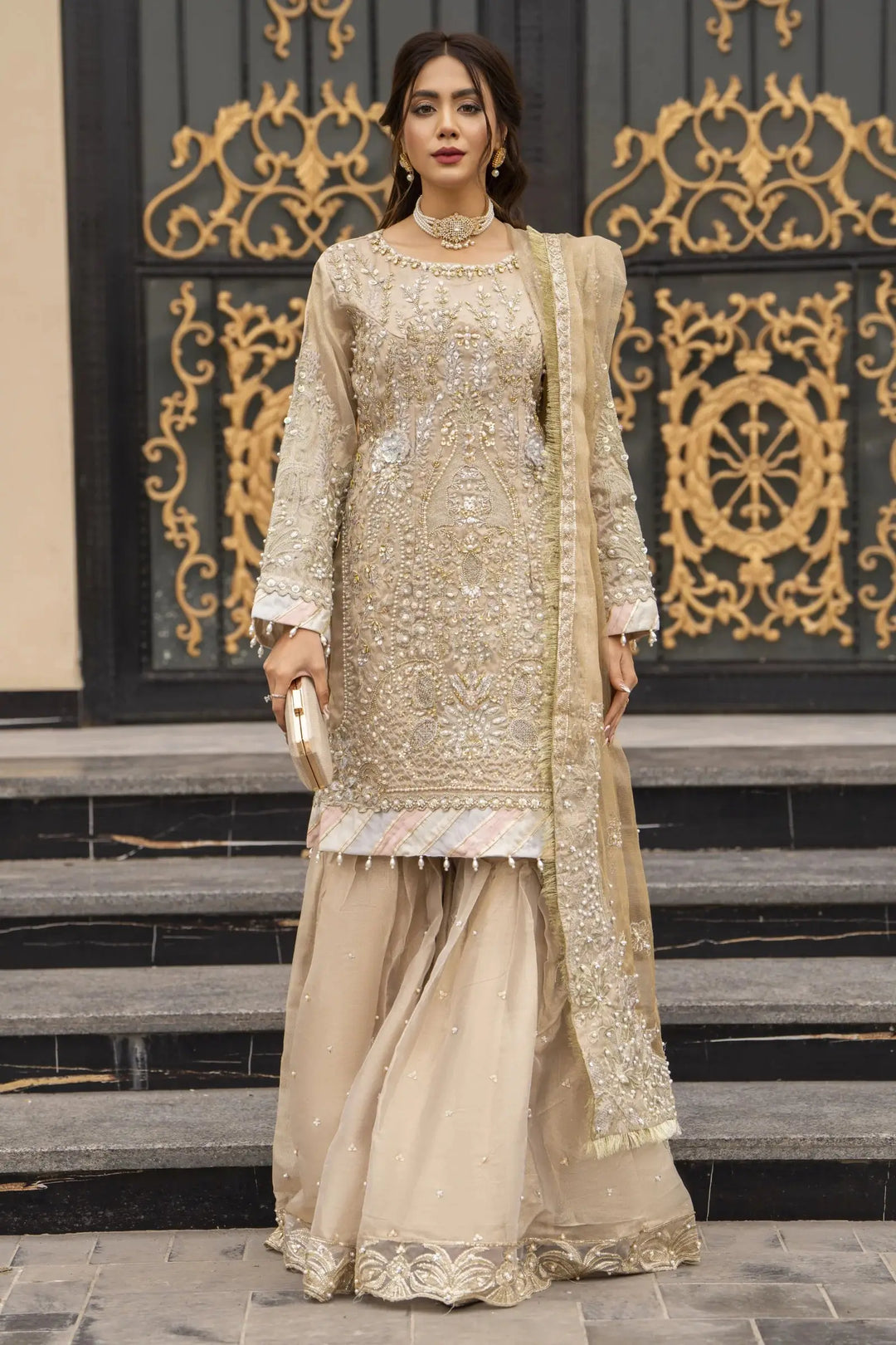 Front pose of AROOSH Kundan Pakistani Dress with gold Masoori embroidery, gharara pants, and embellished dupatta for formal occasions.