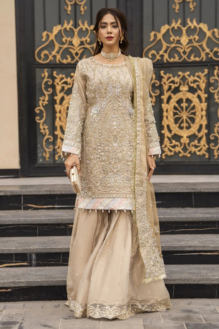 Front pose of AROOSH Kundan Pakistani Dress with gold Masoori embroidery, gharara pants, and embellished dupatta for formal occasions.