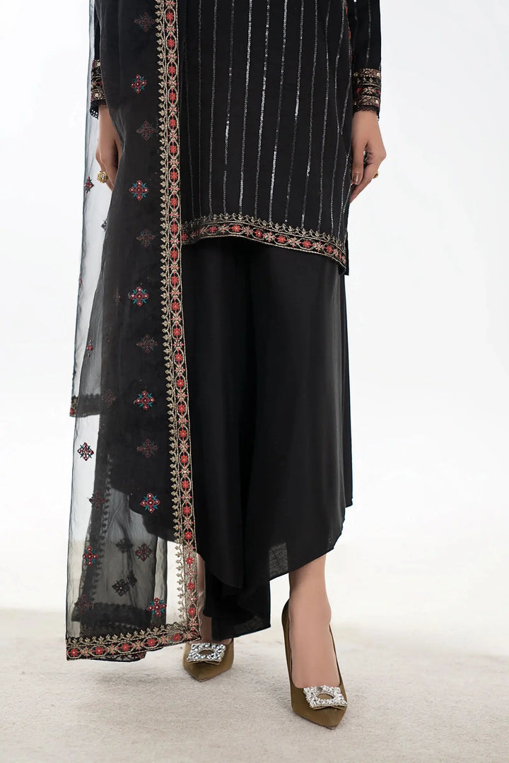 Black linen dupatta paired with embroidered shalwar