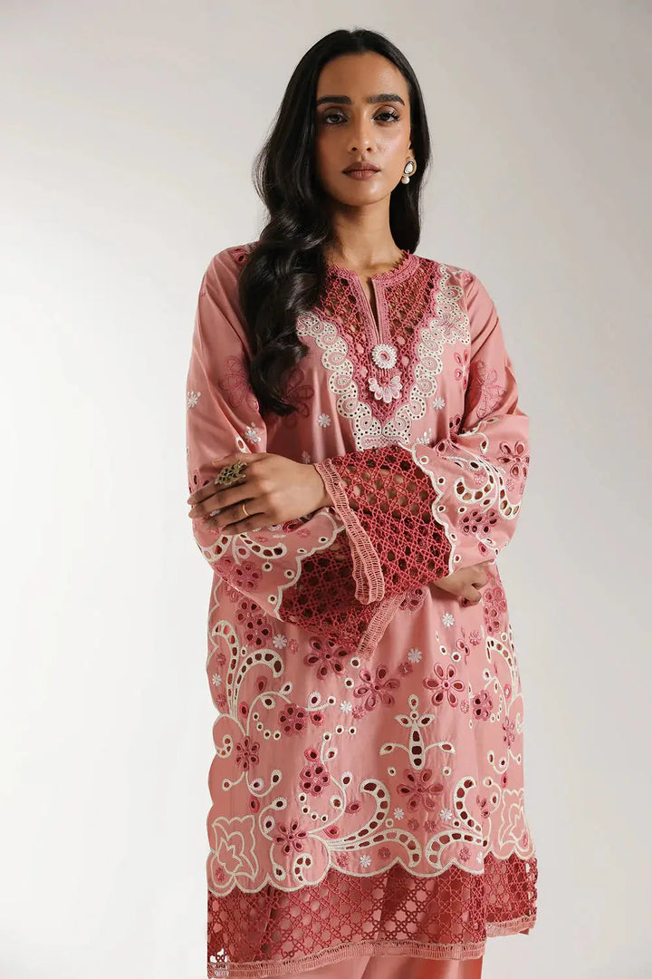 Close-up of EMBROIDERED SUIT E3120 neckline and sleeves, highlighting floral embroidery and lace detailing on blush coral cotton fabric.