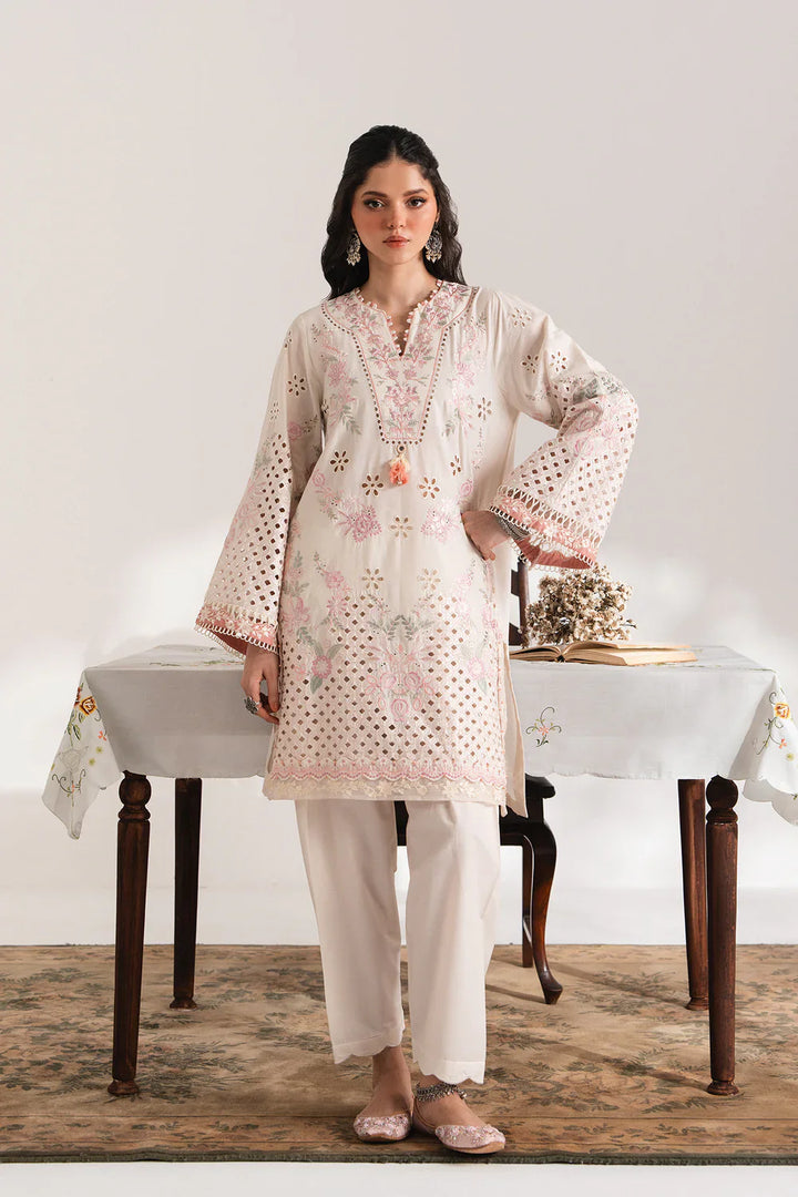 ETHNC EMBROIDERED SUIT - Ethnic USA floral cutwork suit featuring off-white tunic with pink embroidery and matching shalwar. Elegant ethnic wear.