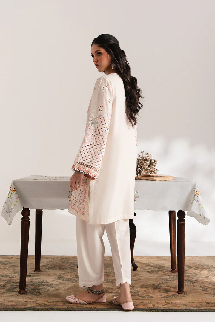 Back view of ETHNC EMBROIDERED SUIT - Ethnic USA floral cutwork suit with intricate sleeve detailing and relaxed fit for stylish comfort.