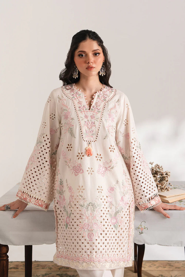 Close-up of ETHNC EMBROIDERED SUIT - Ethnic USA showcasing floral embroidery, cutwork details, and tassel neckline on off-white tunic.
