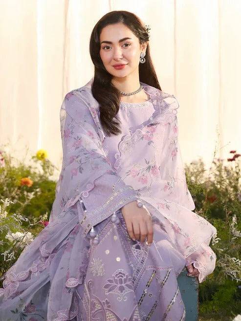 Close-up of woman in lilac embroidered traditional dress with dupatta and jewelry