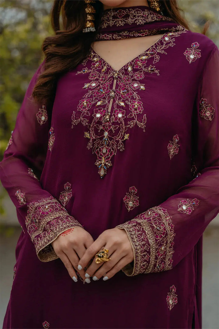 Close-up of CHINYERE Embroidered Suit neckline and sleeves, highlighting mirror, tilla, and Resham embroidery on chiffon fabric.