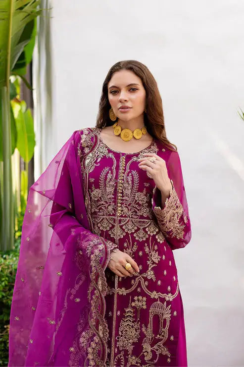 Close-up of MARYUM AND MARIA Pakistani long chiffon dress with ornate gold embroidery on neckline and sleeves.