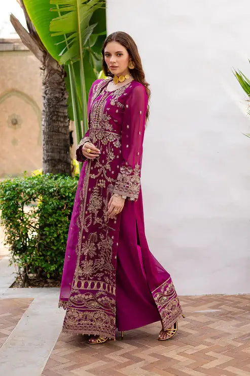 Side pose of model in MARYUM AND MARIA embroidered chiffon 3-piece Pakistani dress, highlighting elegant long shirt design.