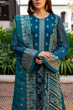 Close-up of Maryum and Maria Dewi embroidered chiffon shirt with ornate sleeve and neckline detailing in teal and gold.
