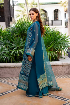 Side view of Maryum and Maria Dewi 3-piece teal chiffon outfit with embroidered shirt, flared pants, and detailed dupatta.