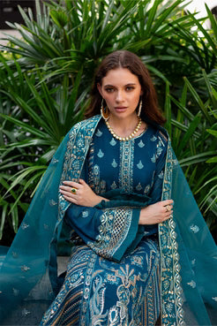 Model wearing Maryum and Maria Dewi 3-piece teal chiffon outfit, highlighting intricate embroidery and organza dupatta.