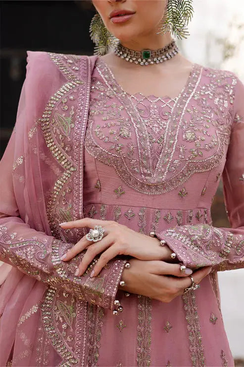 Close-up of MARYUM AND MARIA pink chiffon dress bodice, featuring delicate embroidery, beadwork, and matching accessories for a refined look.