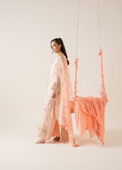 Side profile of MARYUM AND MARIA ELYNA 3 piece chiffon outfit with elegant embroidery and soft peach tones, ideal for festive occasions.