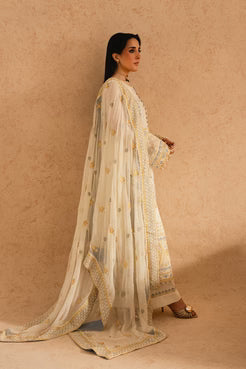 Side view of maryum and maria pk chiffon embroidered outfit with flowing dupatta and intricate embellishments on shirt and sleeves.
