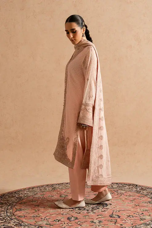 Side profile of MARYUM AND MARIA Nuray chiffon 3 piece suit for women, highlighting the embroidered shirt and matching pants in tea pink.