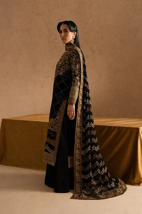 Side profile of Maryum Maria Chiffon Dress - Pakistani Designs | 3-Piece Set with gold embroidered patterns on black chiffon fabric and organza dupatta.
