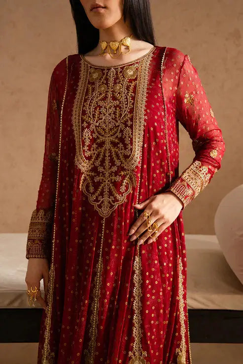 Close-up of MARYUM AND MARIA MELISA chiffon dress highlighting detailed gold embroidery on neckline and sleeves of the maroon shirt.