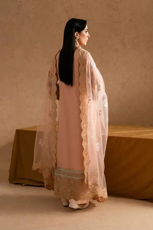 Back view of Maryum and Maria Miray Pakistani party dress in peach chiffon, showcasing embroidered dupatta and detailed hemline.