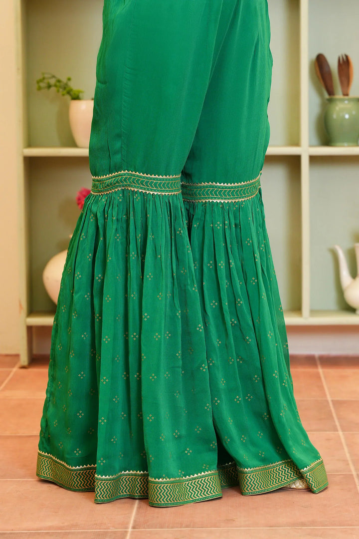 Rang Ja Green Polka Screen Dress pant with flared bottom and embroidered hem, perfect for a stylish and comfortable fit.