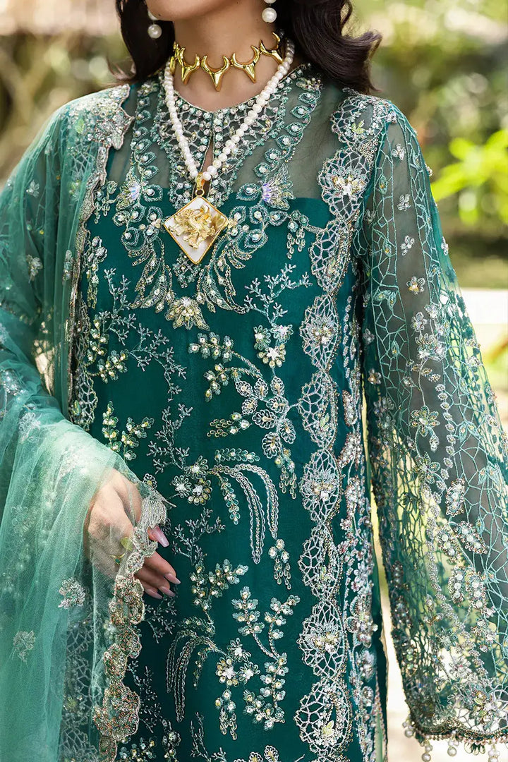 Detailed embroidery on KIANA-SRF25-04 green dress by Saira Rizwan, featuring hand embellishments and ornate neckline design.