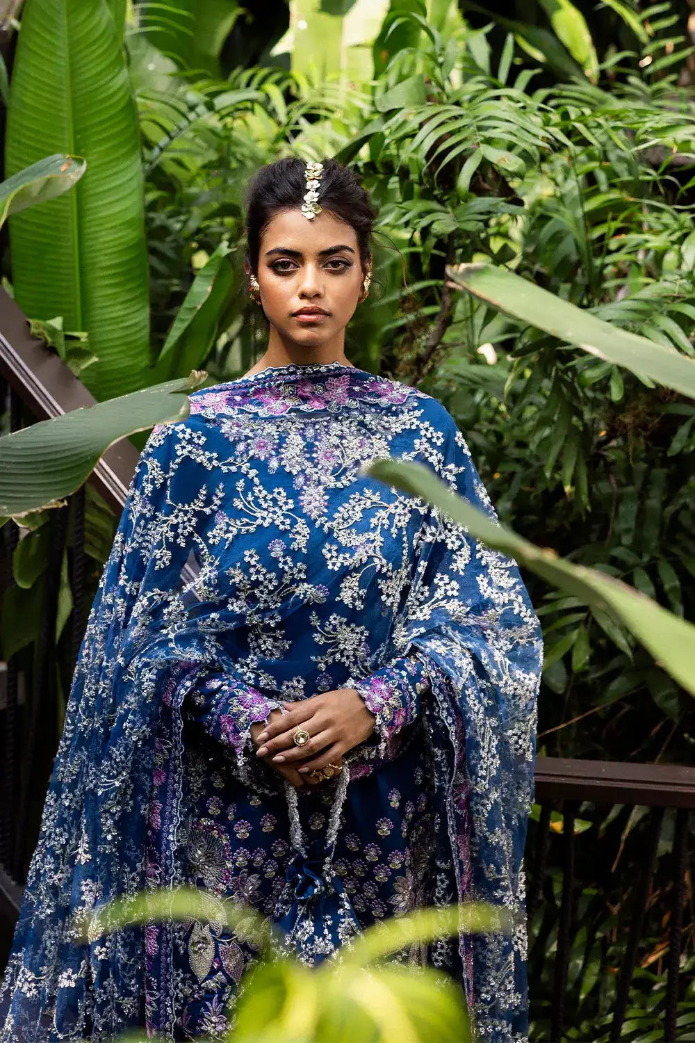 Front view of DELARA-SRF25-08 royal blue net and silk suit by SAIRA RIZWAN LUXURY, featuring floral embroidery and sheer dupatta.