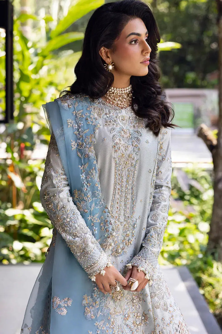 Detailed embroidery and pearl accessories complement the luxury blue SORAYA-SRF25-06 stitched outfit by Saira Rizwan.