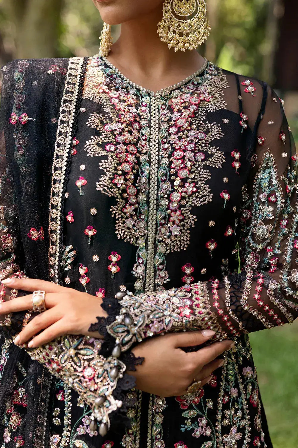 Detailed embroidery on AVINA-SRF25-02 - Saira Rizwan Dress with ornate beadwork and floral patterns on sheer black organza fabric.