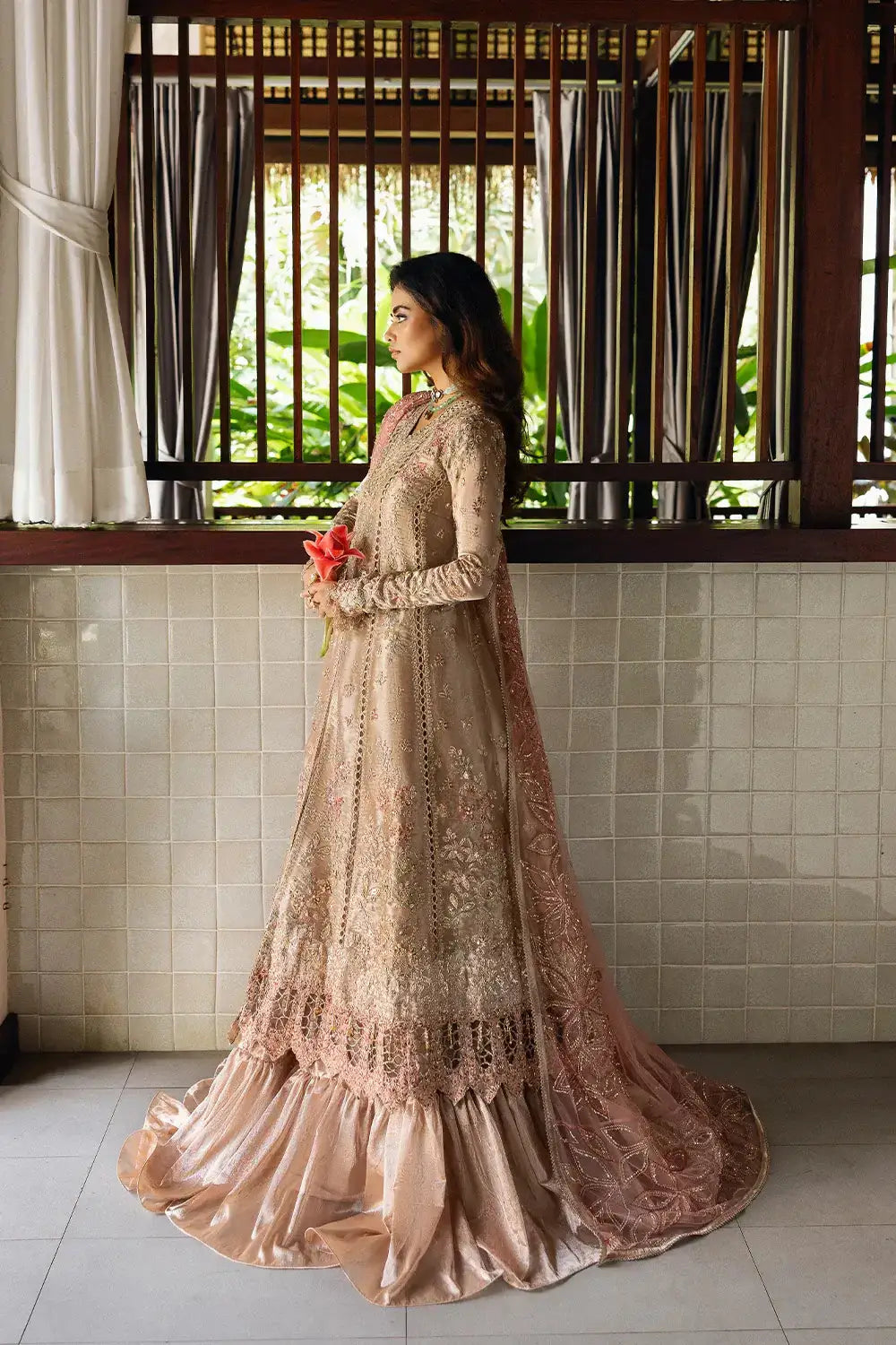Side view of ROHANA-SRF25-03 by Saira Rizwan featuring intricate hand embellishments on organza and zari fabric with flowing silhouette.