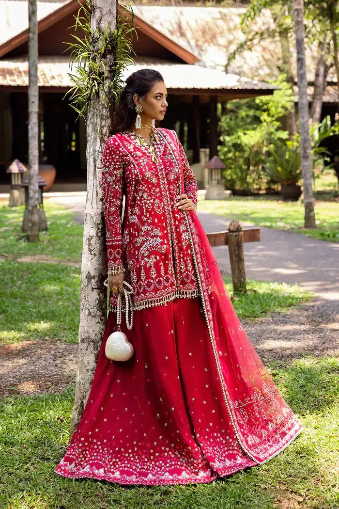 GOLNAR-SRF25-01 - Saira Rizwan Sharara in deep red embroidered silk with dupatta, featuring intricate silver embellishments and flared pants.