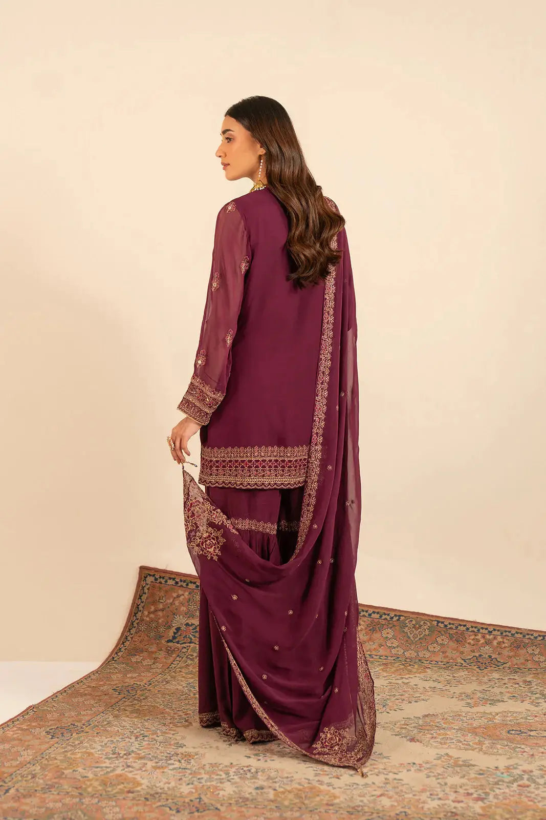 Back view of CHINYERE 3 Piece Chiffon Embroidered Suit in plum, showcasing intricate embroidery on dupatta and shirt sleeves.