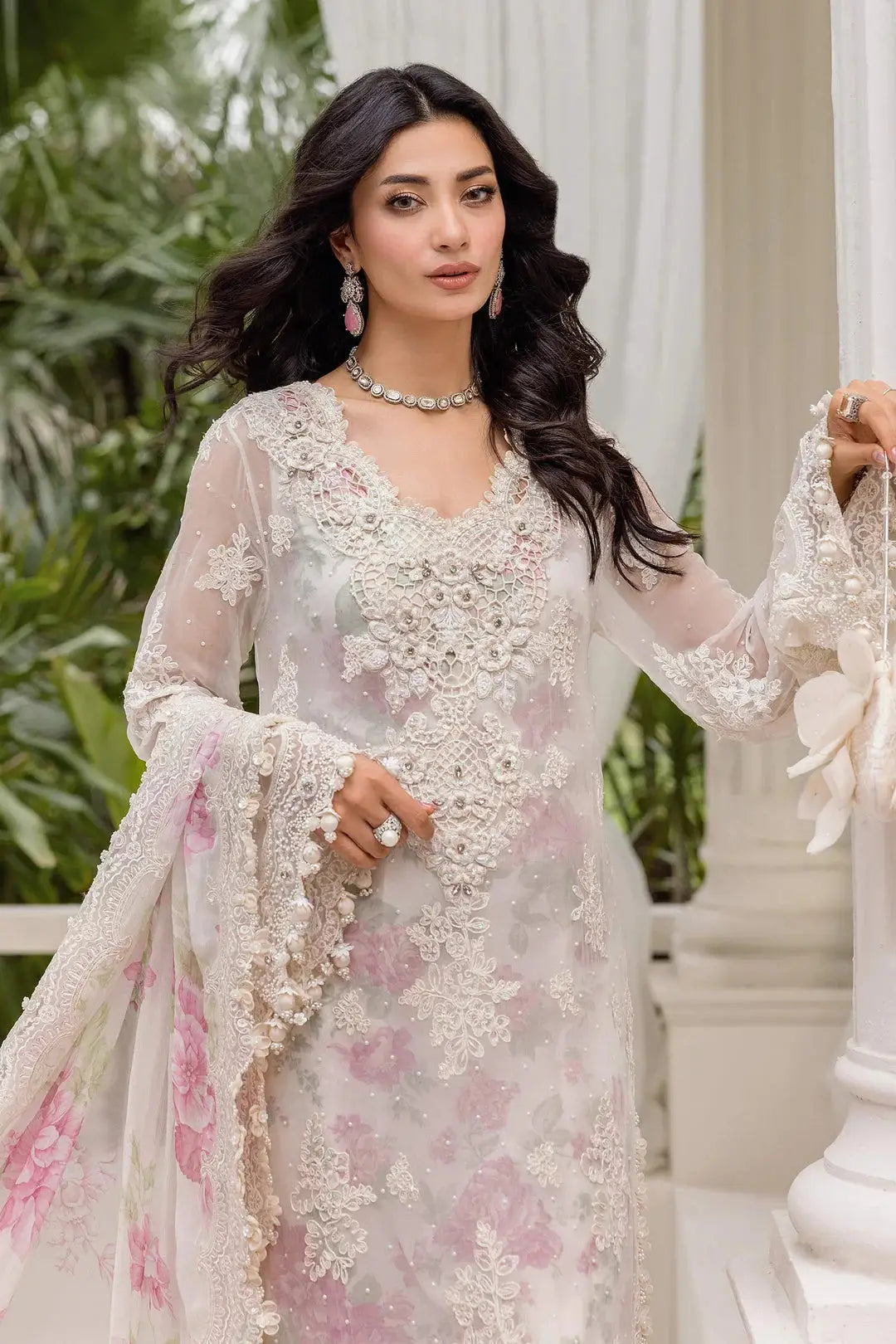 Close-up of RANGREZA AL-4355 showcasing intricate thread embroidery, zari, and sequin embellishments on sheer pastel fabric with floral accents.