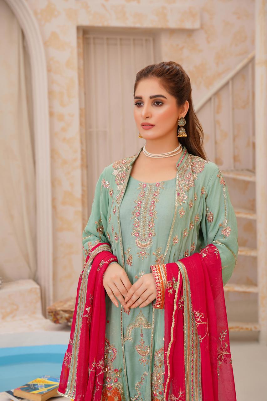 Model in stylish Pakistani dress with red dupatta