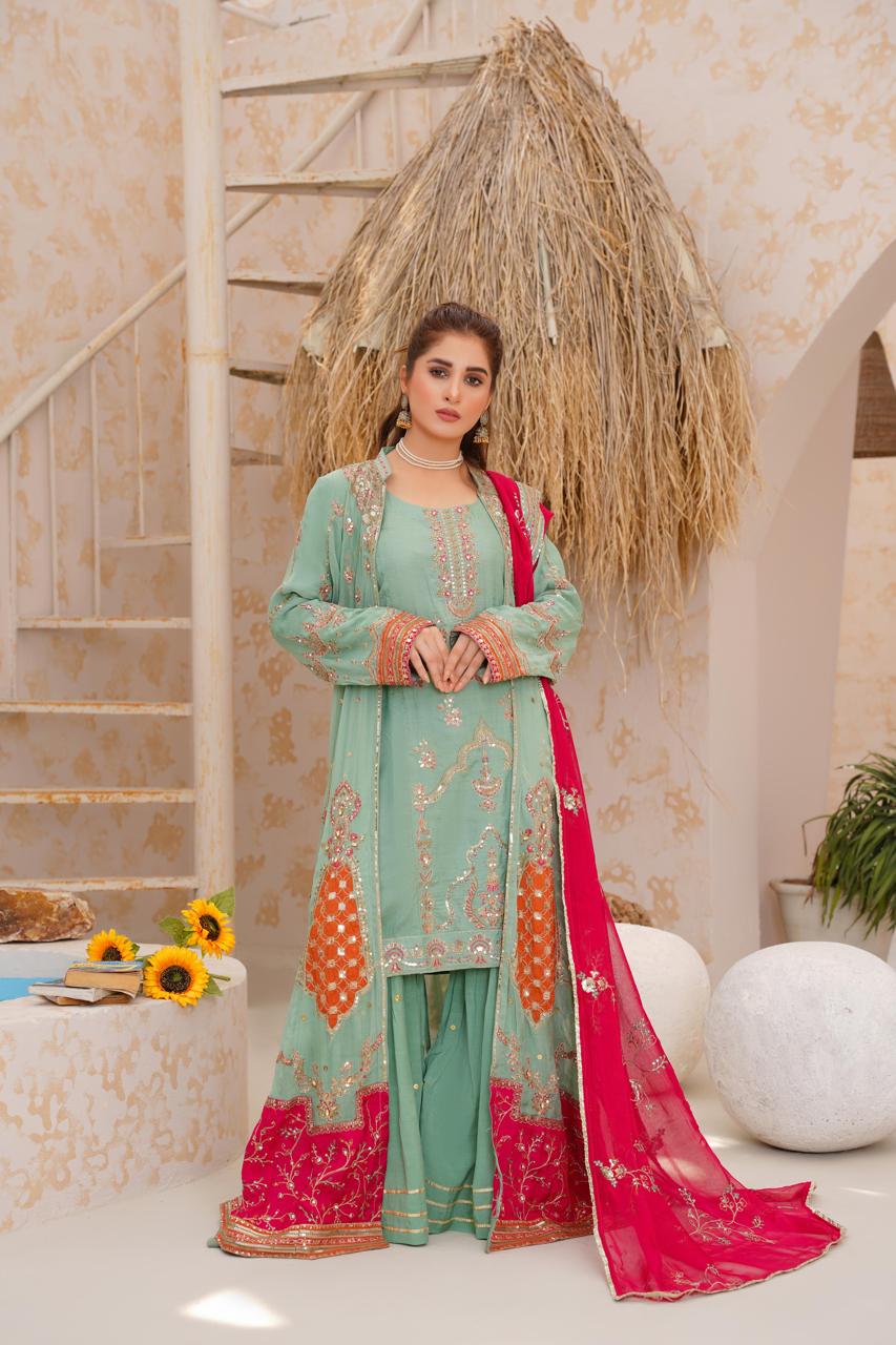 Model showcasing elegant Pakistani dress with dupatta