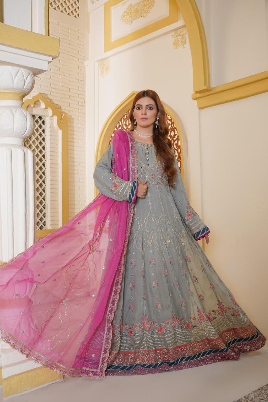 Model showcasing Pakistani dress with flowing dupatta