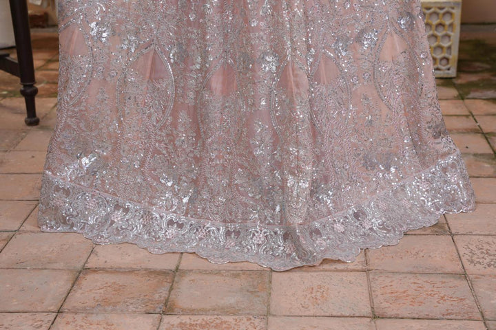 Hemline details of Pakistani wedding dress with silver accents