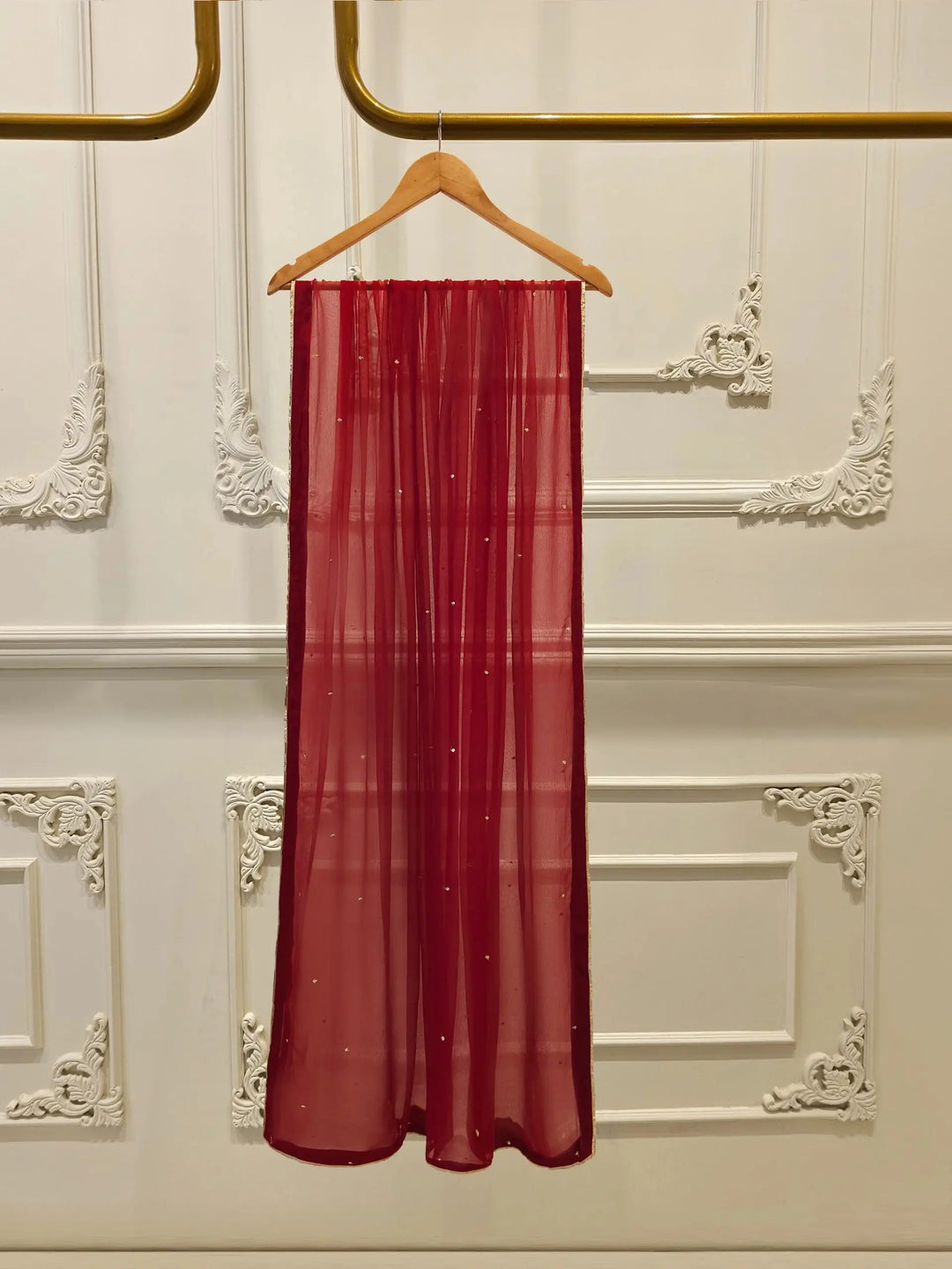 Red chiffon dupatta from AGHA NOOR Embroidered Suit - USA | Cotton Elegance, adorned with subtle embellishments and gold trim for a graceful look.