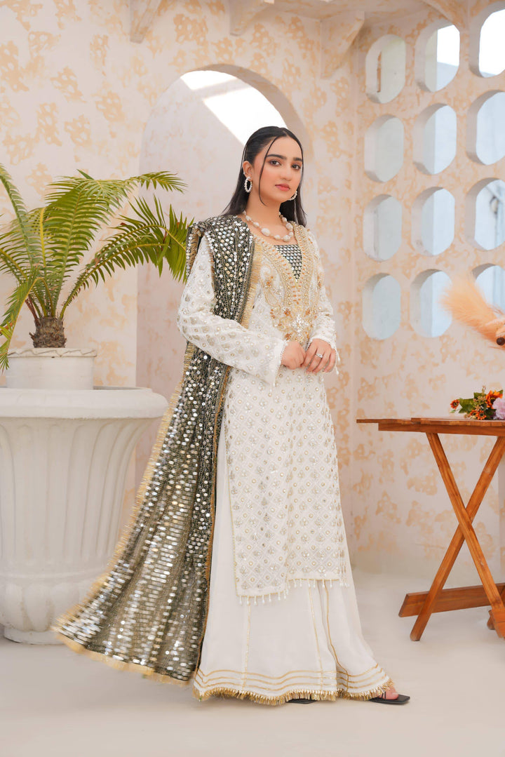 RANGREZA SAJNI shirt pants and dupatta set in white with gold embellishments and a shimmering dupatta, styled for festive wear.