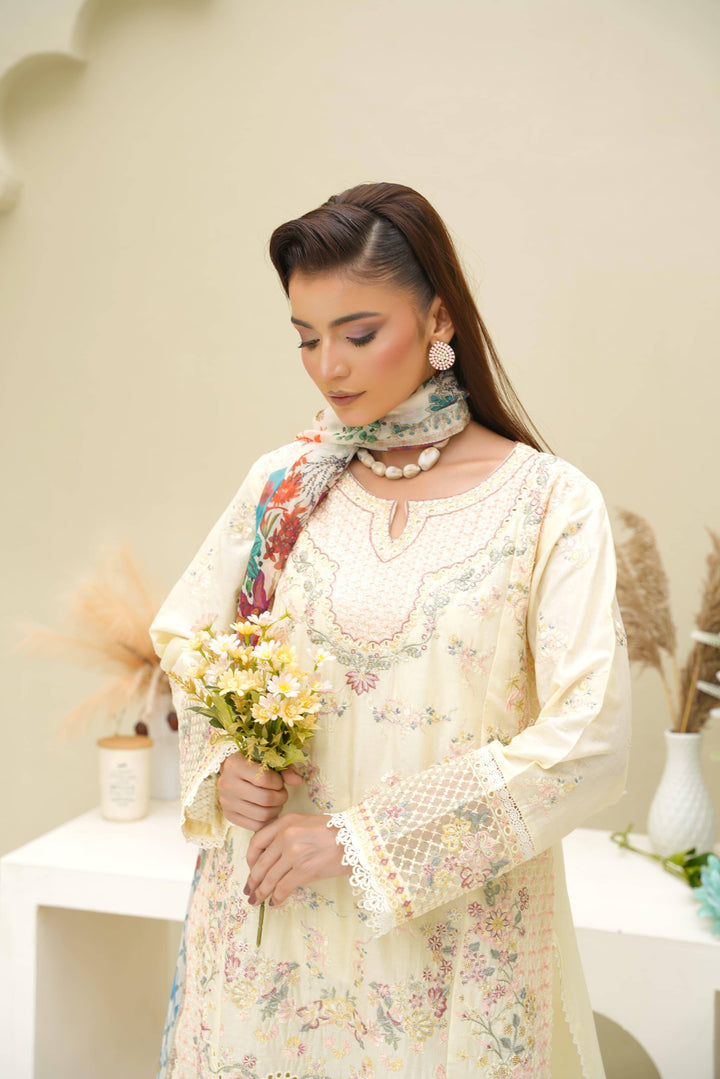 Close-up of model in Rangreza Sajni Formal Pakistani Clothes | Skin Lawn holding flowers, highlighting neckline embroidery and soft fabric.