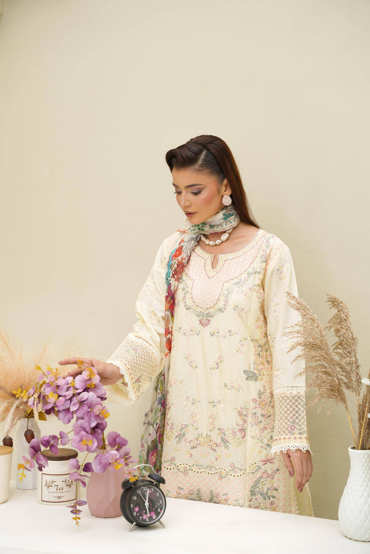 Model in Rangreza Sajni Formal Pakistani Clothes | Skin Lawn interacting with decor, emphasizing sleeve embroidery and soft pastel tones.