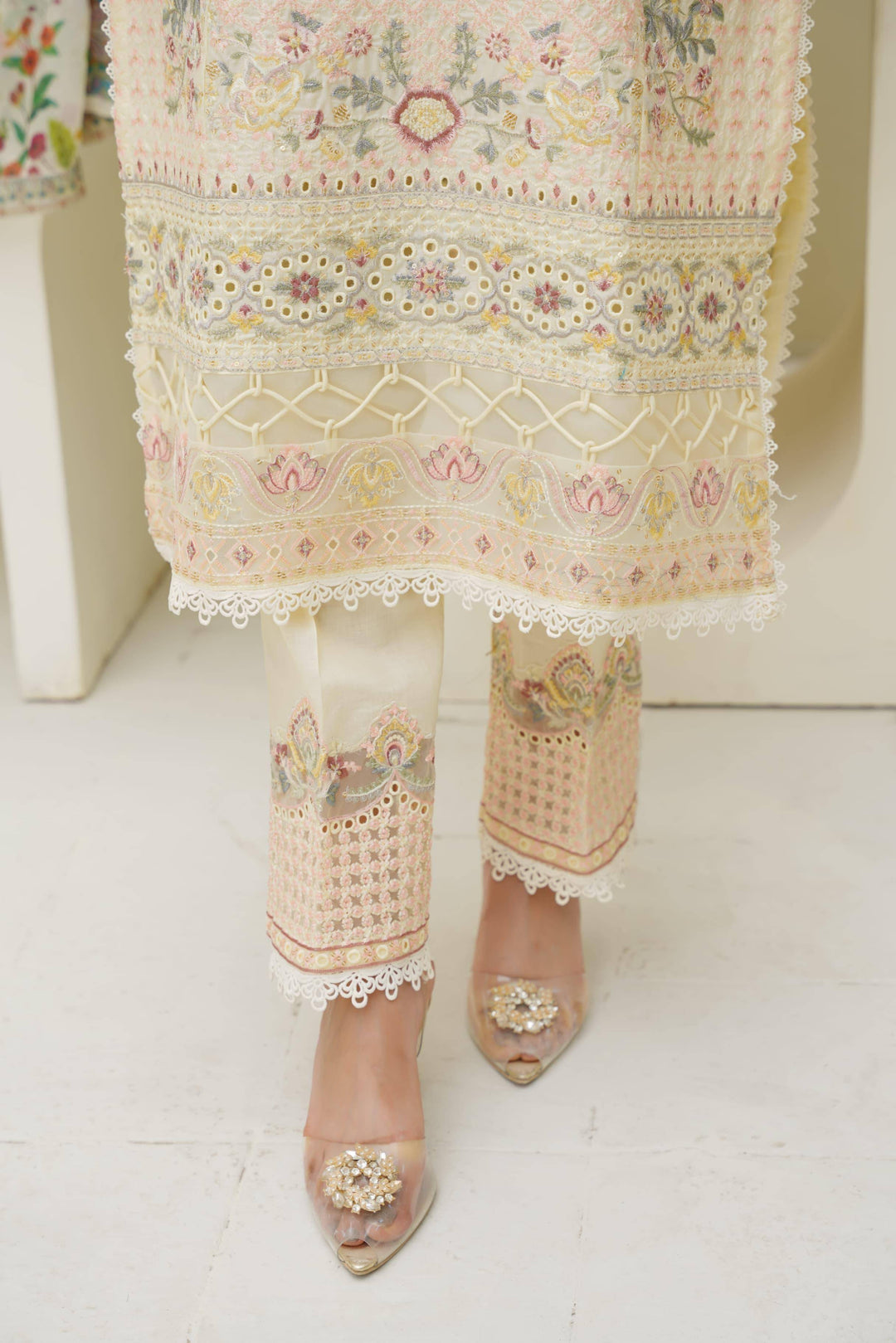 Bottom hem and pants of Rangreza Sajni Formal Pakistani Clothes | Skin Lawn with intricate embroidery and lace detailing.