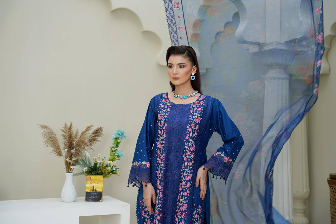 Close-up of RANGREZA SAJNI RS-3518-1000 showcasing intricate floral embroidery on the neckline and sleeves of the Pakistani festive suit.