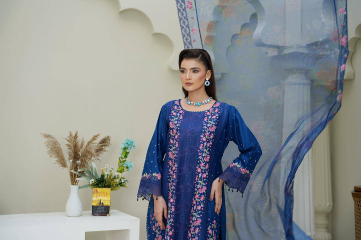 Close-up of RANGREZA SAJNI RS-3518-1000 showcasing intricate floral embroidery on the neckline and sleeves of the Pakistani festive suit.