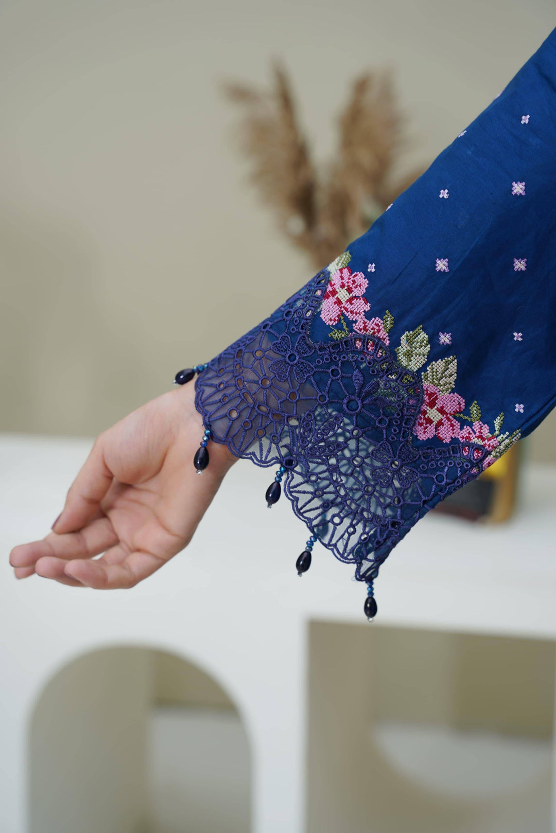 Detailed sleeve embroidery of RANGREZA SAJNI RS-3518-1000 featuring lace and beadwork, highlighting craftsmanship in Pakistani festive wear.