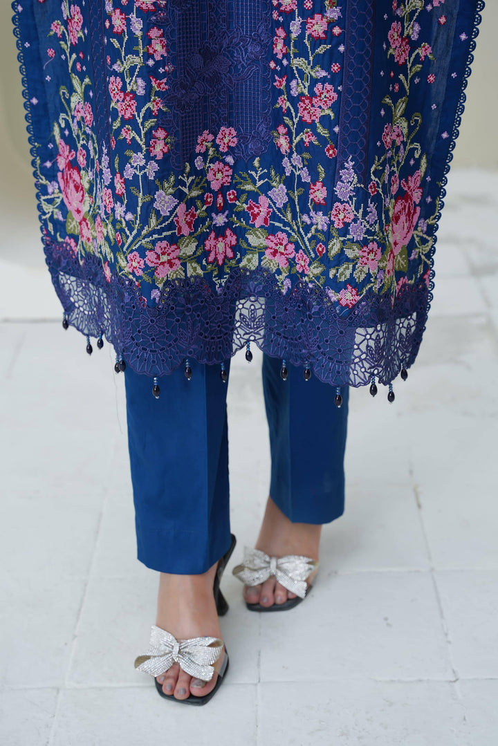 Bottom hem and pants of RANGREZA SAJNI RS-3518-1000 with floral embroidery and lace detailing, paired with silver heels for a festive look.