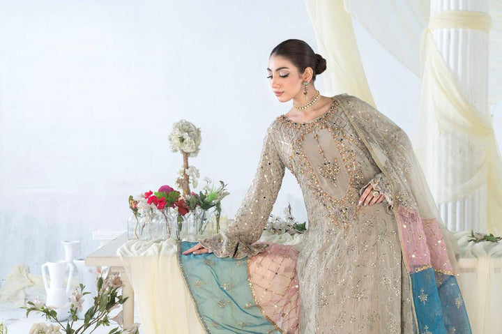 Model posing in RANGREZA SAJNI RS-3526-1500 with embellished chiffon shirt and pastel organza dupatta, ideal for women Pakistani festive wear.