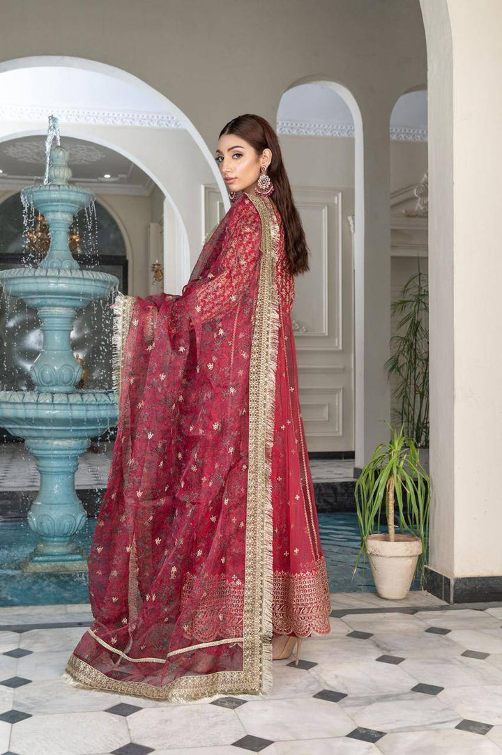 Back view of RANGREZA SAJNI - Pakistani Outfits | Pink Long Frock Set showcasing detailed embroidery and gold-trimmed organza dupatta in traditional attire.