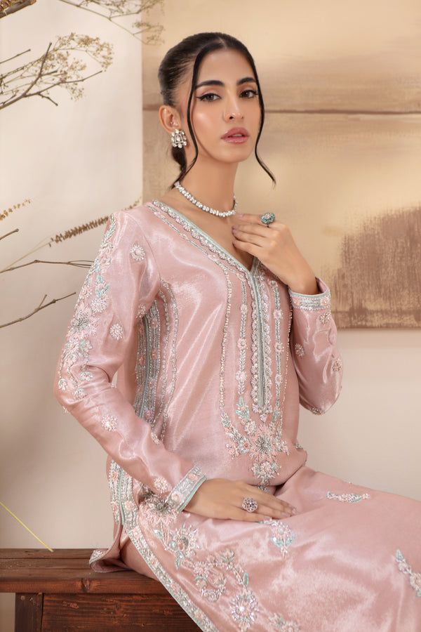 Close-up of Sarosh Salman pink raw silk dress highlighting detailed pearl and sequin handwork, ideal for festive and wedding attire.